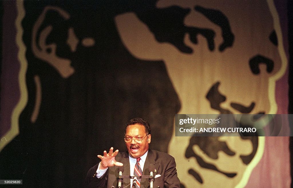 Rev. Jesse Jackson, Sr. gestures as he gives a spe