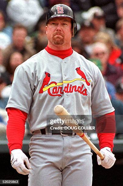 St. Louis Cardinals player Mark McGwire reacts after taking a strike from Colorado Rockies pitcher Pedro Astacio during their game 07 April at Coors...