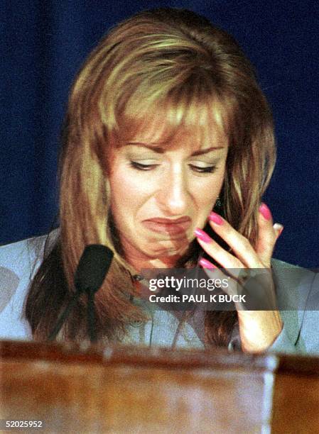 Paula Jones breaks into tears while reading a statement announcing her intention to appeal the Arkansas federal district court's decision to dismiss...