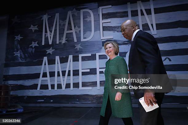 Democratic presidential candidate Hillary Clinton and Rep. Elijah Cummings take the stage during a campaign rally at City Garage April 10, 2016 in...