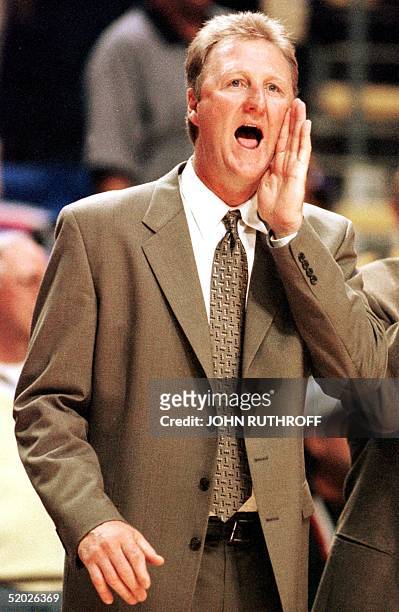 Larry Bird, head coach of the Indiana PacersK, yells to his players during the second half of game three of his team's NBA Eastern Conference finals...