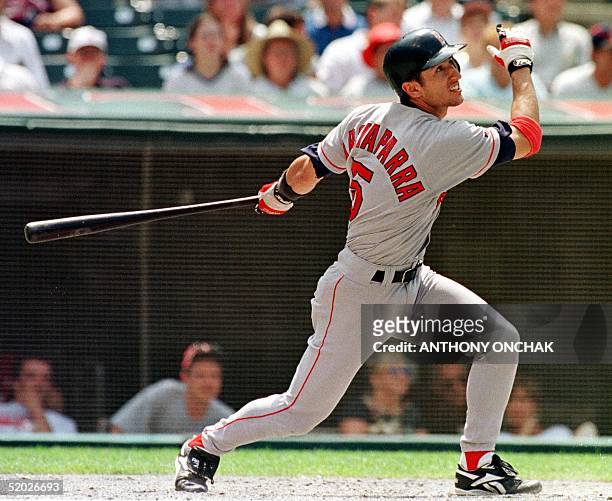 Boston Red Sox player Nomar Garciaparra watches as his sixth inning home run goes over the left field wall during Boston's game with the Cleveland...