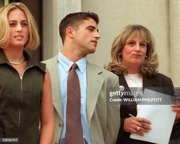Linda Tripp waits to make a statement to reporters beside her daughter Allison and son Ryan in front of the Federal Courthouse 29 July in Washington,...