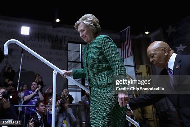 Democratic presidential candidate Hillary Clinton and U.S. Rep. Elijah Cummings take the stage during a campaign rally at City Garage April 10, 2016...