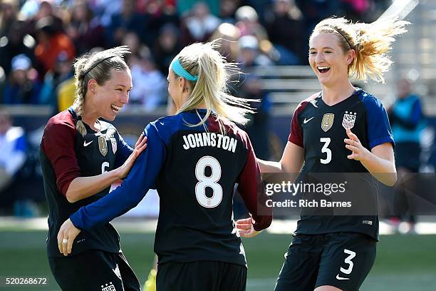 Julie Johnston of the United States celebrates her goal with teammates Whitney Engen and Samantha Mewis against Colombia during the second half at...