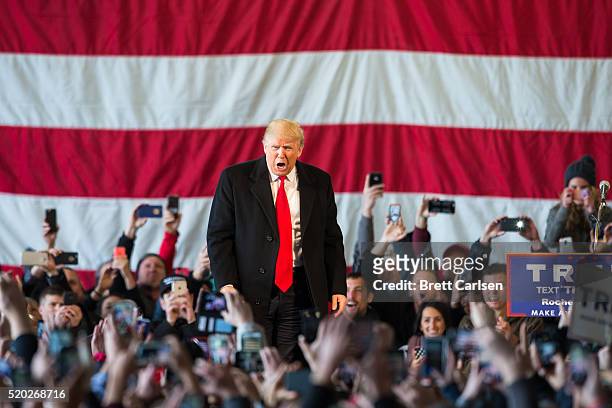 Republican presidential candidate Donald Trump speaks in front of a capacity crowd at a rally for his campaign on April 10, 2016 in Rochester, New...