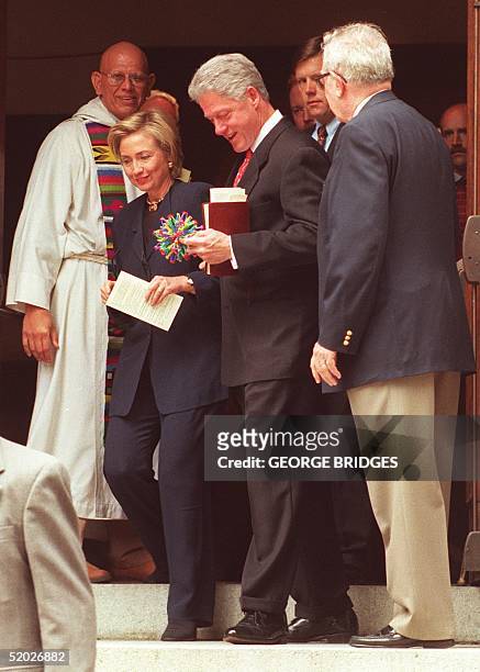 President Bill Clinton and First Lady Hillary Rodham Clinton leave Foundry United Methodist Church in Washington, DC after services 16 August to...