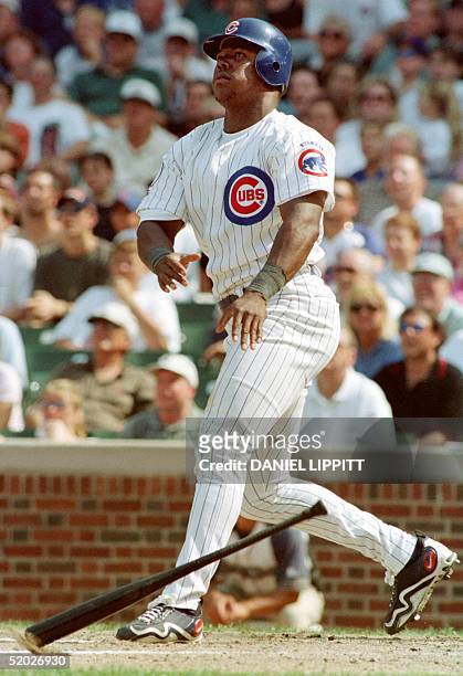Chicago Cubs' Glenallen Hill watches his pinch-hit grand slam home run leave the ballpark during the fifth inning of their game against the San...