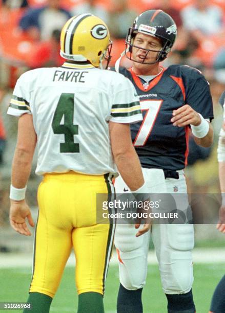Quarterbacks John Elway of the Super Bowl XXXII Champion Denver Broncos and Brett Favre of the Green Bay Packers talk before the start of their...