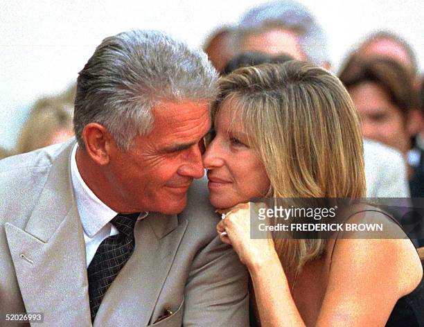 Actor James Brolin and his singer-actress wife Barbra Streisand share a tender moment during the Hollywood Walk of Fame ceremony for Brolin 27 August...