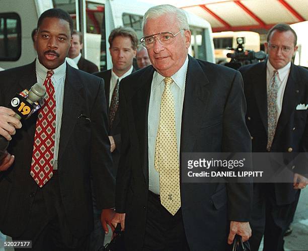 Baltimore Ravens owner Art Modell , flanked by NFL security and the media, enters a meeting with the NFL owners to decide who will be awarded the...