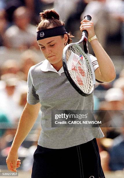 Number one seeded Martina Hingis of Switzerland swings the racket near her head during her match against number three seeded Jana Novotna of the...