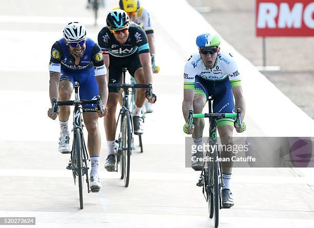 Mathew Hayman of Australia and Orica GreenEDGE wins in front of Tom Boonen of Belgium and Ettxx-Quick Step and Ian Stannard of Great Britain and Team...