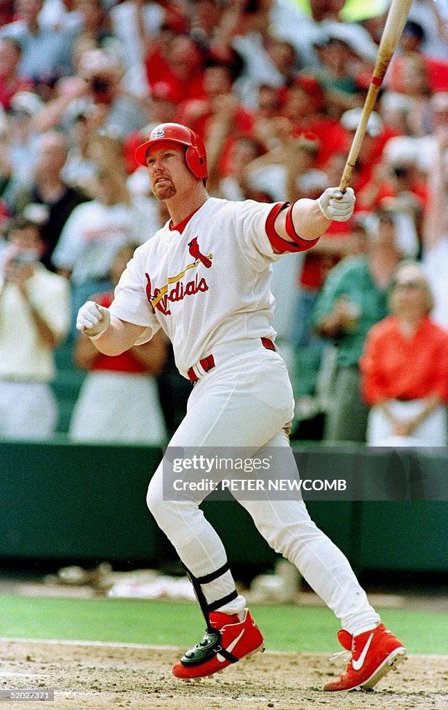St. Louis Cardinal first baseman Mark McGwire watc