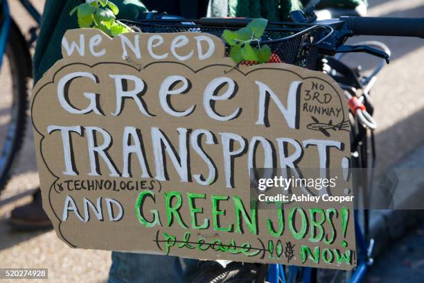 protest sign on bicycle at climate change rally - bike rally stock-fotos und bilder