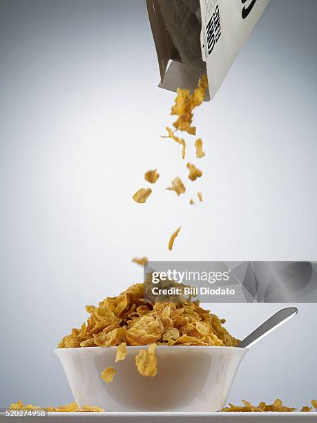 bowl of cereal - bowl of cornflakes stock-fotos und bilder