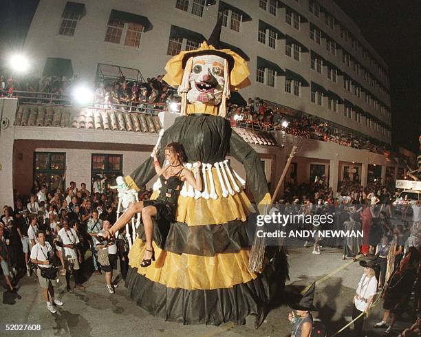 Held in the clutches of "The Flying Bitch of Duval Street," Marcia Marinez of Key West is carried during the Key West, FL, Fantasy Fest Parade 31...