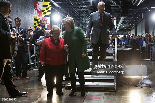 Hillary Clinton, former Secretary of State and 2016 Democratic presidential candidate, center, walks with Senator Barbara Mikulski, a Democrat from...
