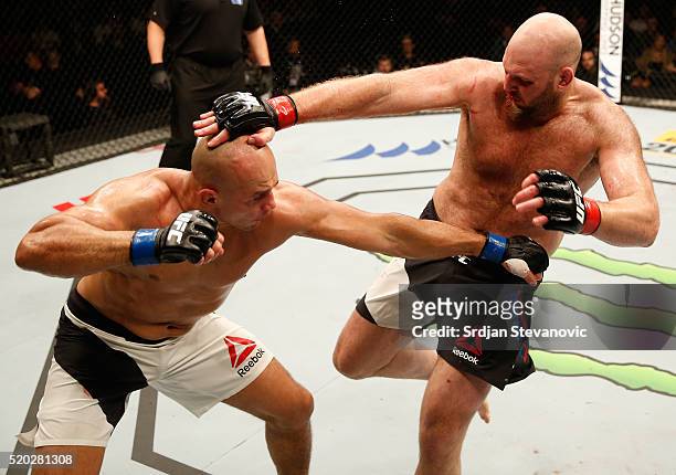 Junior Dos Santos punches Ben Rothwell in their heavyweight bout during the UFC Fight Night event at the Arena Zagreb on April 10, 2016 in Zagreb,...