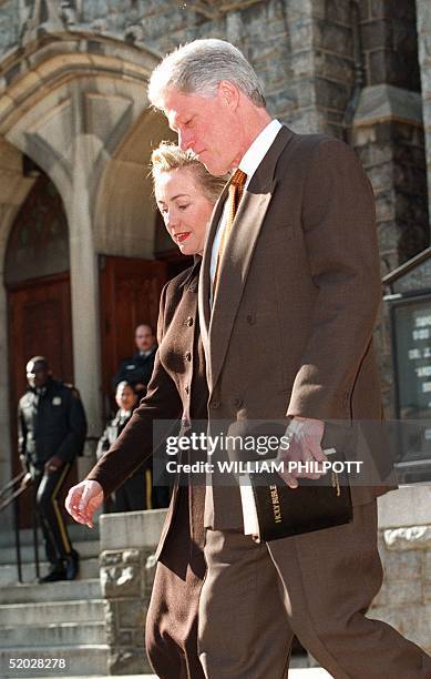 President Bill Clinton and wife, Hillary, leave the Foundry Methodist Church in Washington, DC 17 January. The impeachment trial of US President Bill...