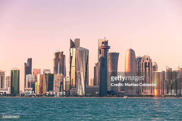 doha financial center skyline at sunset, qatar - qatar stock pictures, royalty-free photos & images