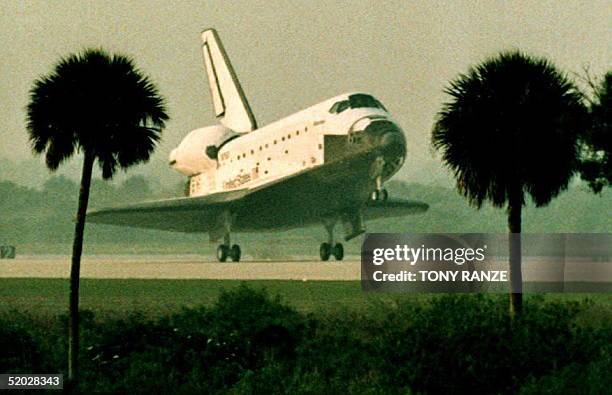 The space shuttle Atlantis lands at 6:23 a.m. Shortly after sunrise 02 April 1992. The landing concluded a successful nine-day science mission to...