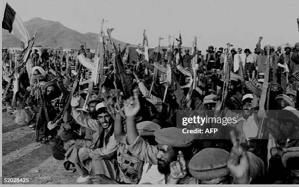 Guerrillas of Hezb-i-Islami loyal to Gulbuddin Hekmatyar fire in the air on the outskirts of Jalalabad before entering the city 25 April 1992....