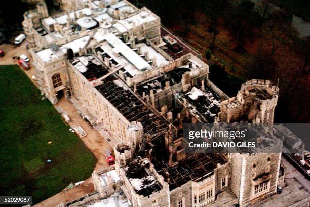 This 23 November aerial view of Windsor Castle in the United Kingdom shows damage to the roof caused by the fire which broke out 20 November....