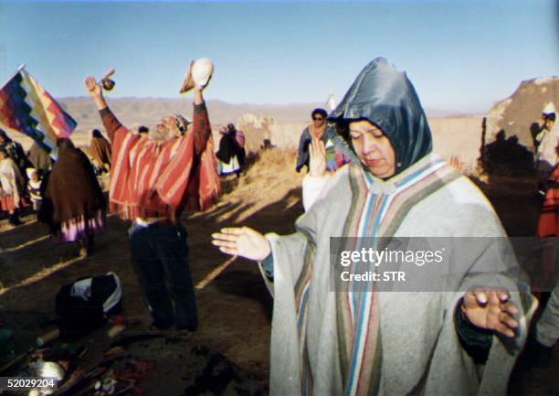 Bolivian woman , a member of the Aymara Indian tribe, waits for the first rays of the sun 21 June the first day of summer and start of the Aymara New...