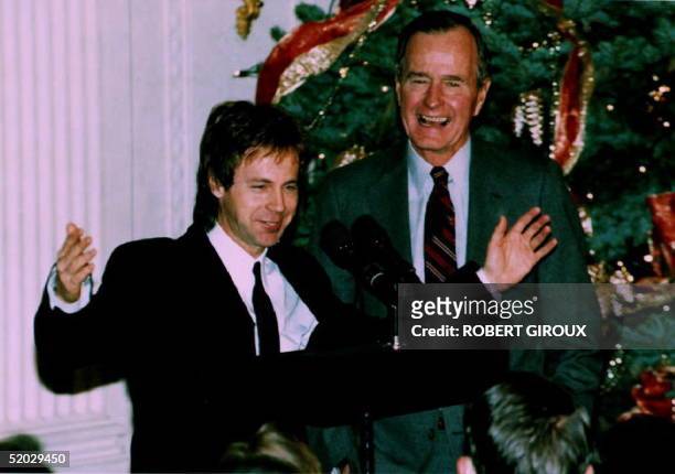 President George Bush watches as comedian Dana Carvey does his George Bush impersonation 07 December 1992 Carvey and his wife Paula spent the night...