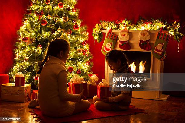 opening a christmas presents - kid stocking stock pictures, royalty-free photos & images