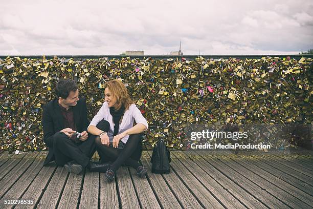 love locks on a bridge in paris - kärlekslås bildbanksfoton och bilder