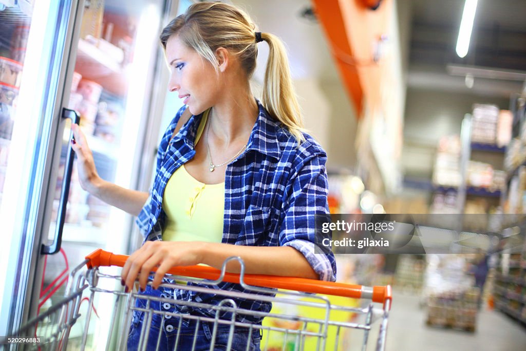 Woman buying frozen food.