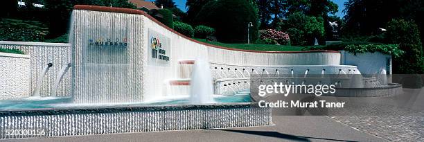 fountain at entrance of olympic museum - olympic museum lausanne stock pictures, royalty-free photos & images