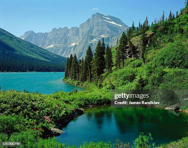 lake josephine and grinnell point - grinnell lake bildbanksfoton och bilder