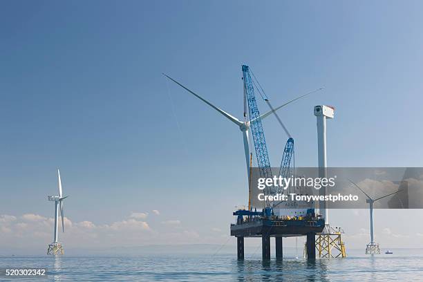 wind turbine construction, cumbria, england, uk - irish sea stock pictures, royalty-free photos & images