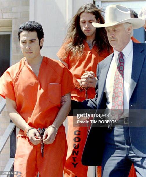 Branch Davidian cult members Jaime Castillo and David Thibodeau are led from the federal court building after their arraignment 20 April 1993 in...
