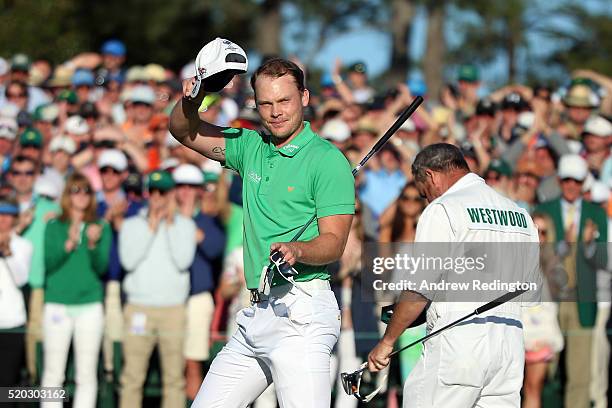 Danny Willett of England reacts after finishing on the 18th green during the final round of the 2016 Masters Tournament at Augusta National Golf Club...