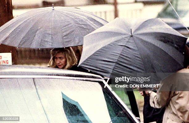 First Lady Hillary Rodham Clinton enters the presidential limousine as she leaves the Court Street United Methodist Church 10 April 1993 after...