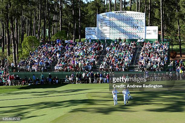 Danny Willett of England and caddie Jonathan Smart walk on the 15th hole during the final round of the 2016 Masters Tournament at Augusta National...