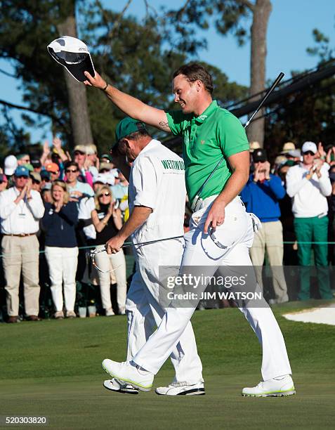 England's Danny Willett celebrates on the 18th green during Round 4 of the 80th Masters Golf Tournament at the Augusta National Golf Club on April 10...