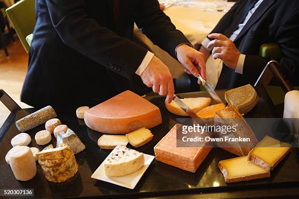 selection of cheeses at the paul bocuse institute - bocuse stock pictures, royalty-free photos & images