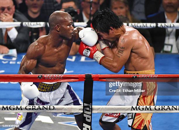 Timothy Bradley Jr. And Manny Pacquiao battle in the eighth round of their welterweight fight at MGM Grand Garden Arena on April 9, 2016 in Las...