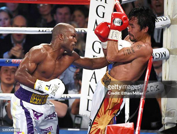 Timothy Bradley Jr. Throws a left at Manny Pacquiao in the eighth round of their welterweight fight at MGM Grand Garden Arena on April 9, 2016 in Las...