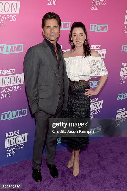 Actor John Stamos and actress Paget Brewster attend 2016 TV Land Icon Awards at The Barker Hanger on April 10, 2016 in Santa Monica, California.