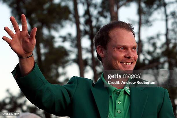 Danny Willett of England celebrates after being presented with the green jacket for winning the final round of the 2016 Masters Tournament at Augusta...