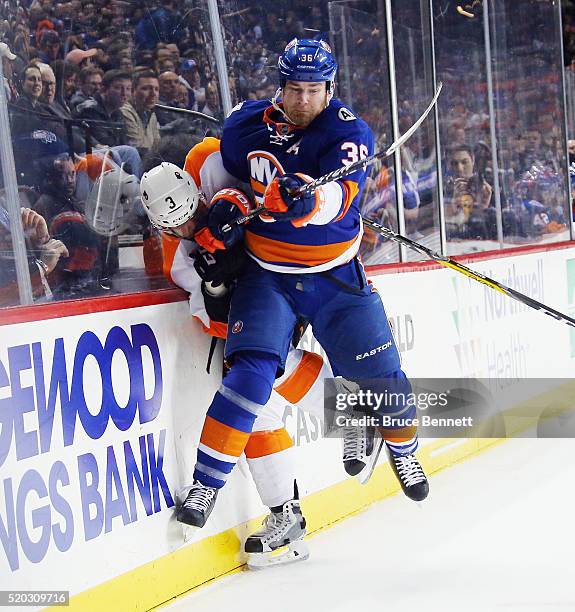 Eric Boulton of the New York Islanders steps into Radko Gudas of the Philadelphia Flyers during the first period at the Barclays Center on April 10,...