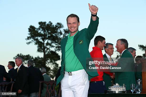 Danny Willett of England celebrates after being presented with the green jacket for winning the final round of the 2016 Masters Tournament at Augusta...