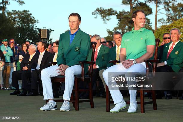 Danny Willett of England celebrates winning during the green jacket ceremony with Jordan Spieth of the United States after the final round of the...