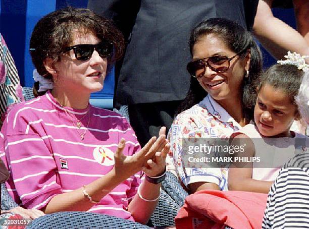 Monica Seles makes her first public appearance during the Arthur Ashe AIDS-Tennis Challenge 29 August 1993 joining Ashe's widow, Jeanne Moutoussammy...